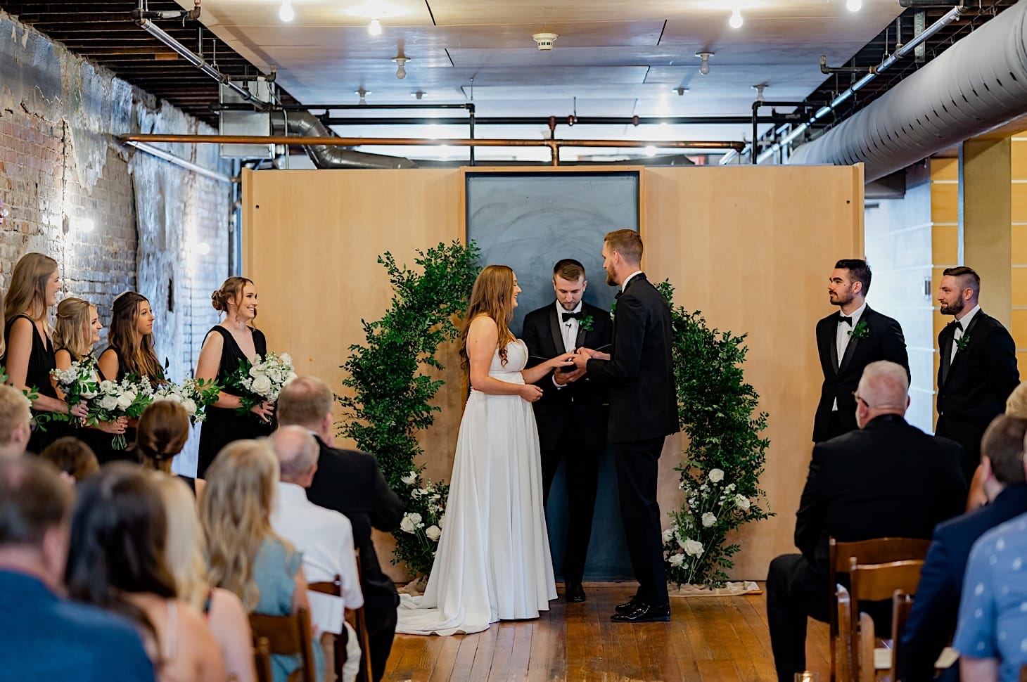 38 bride and groom vows at teachout building des moines