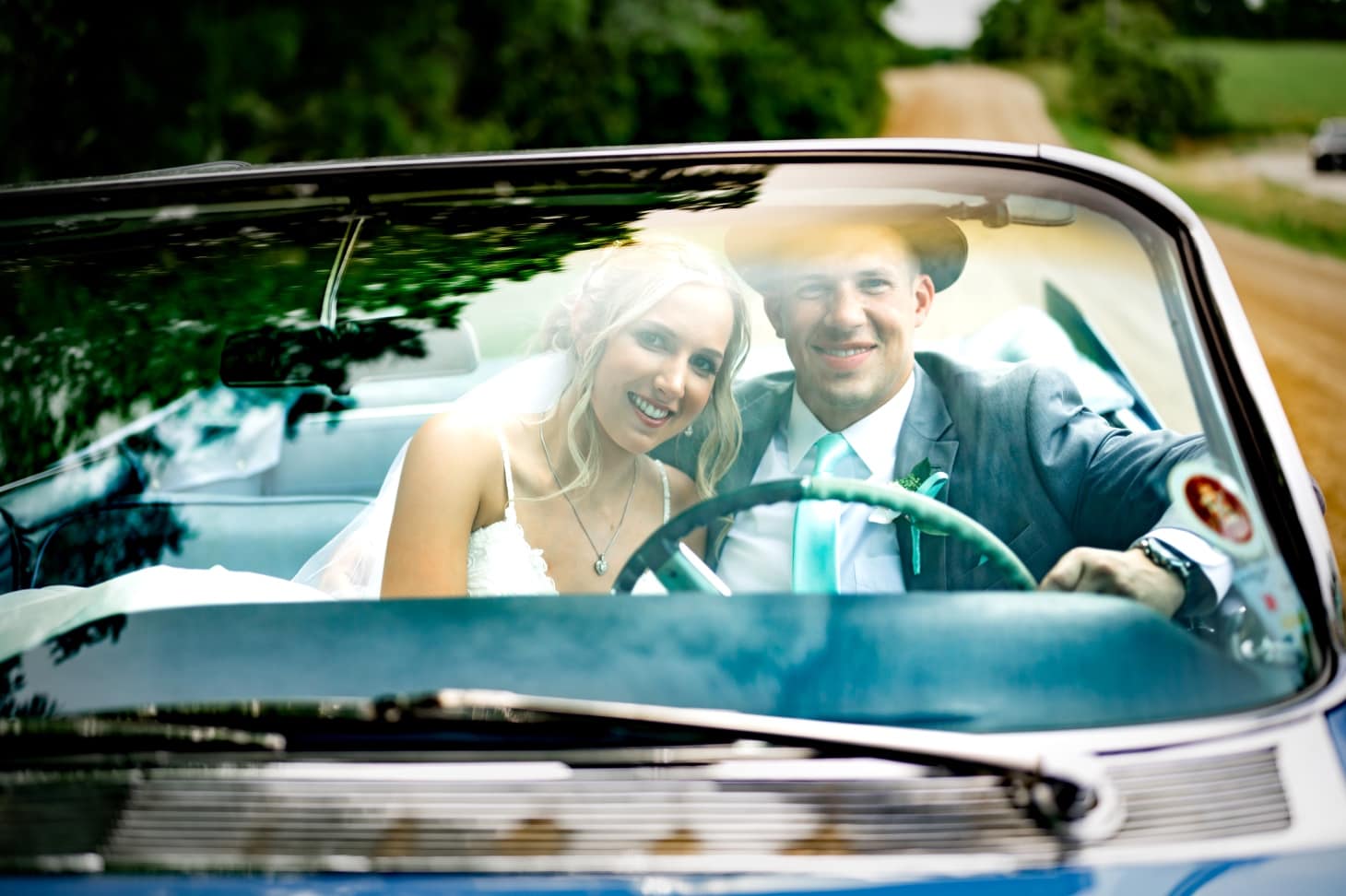 41 bride and groom in sports car carper winery
