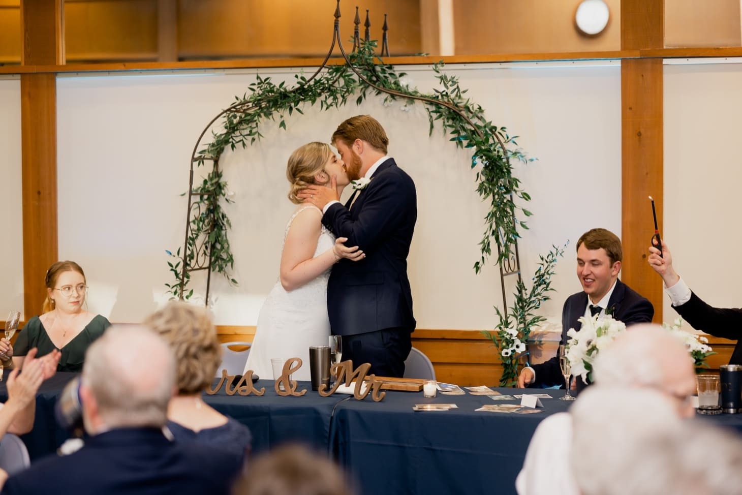 57 bride and groom kiss reiman gardens reception