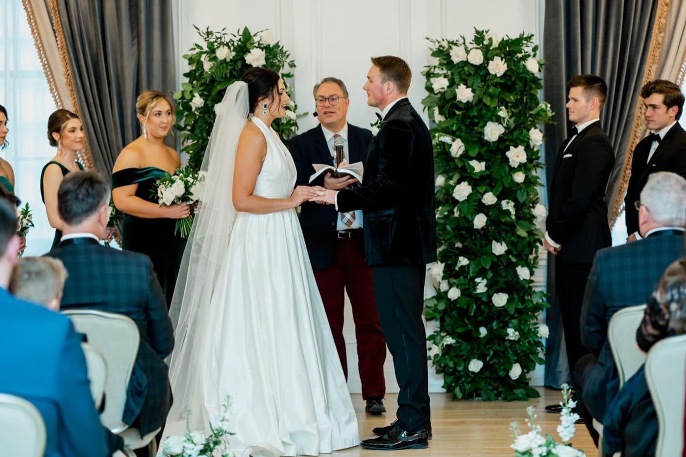 exchanging rings at hotel fort des moines wedding ceremony