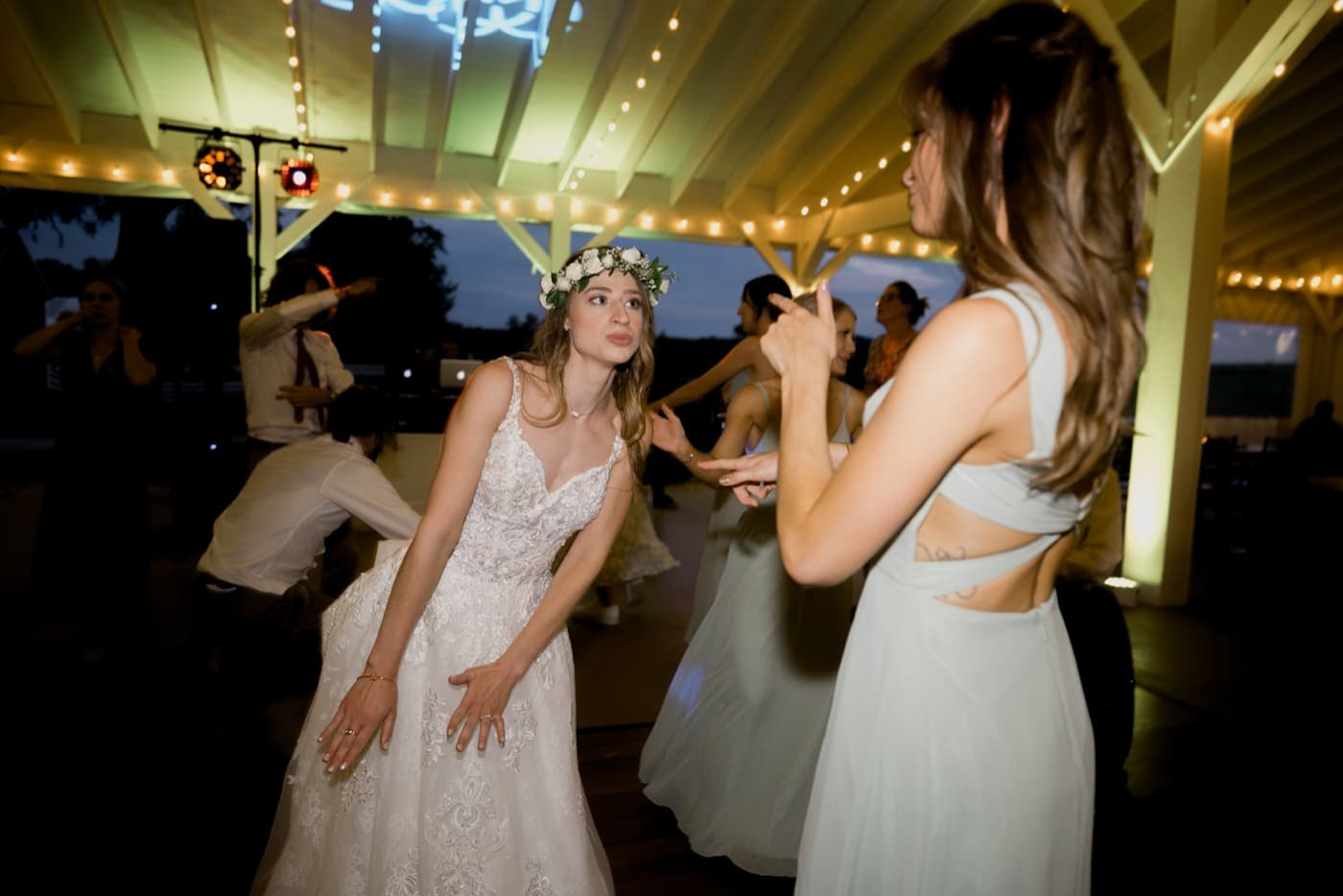 bride and bridesmaid dancing