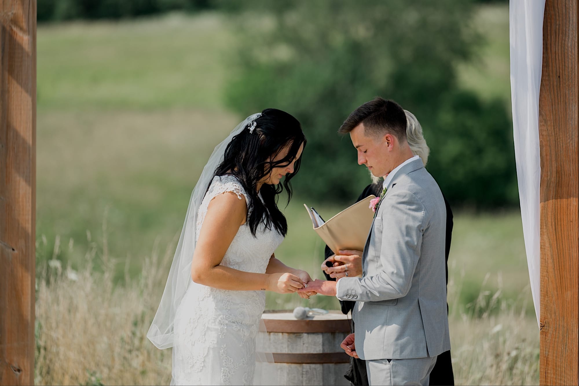 exchanging rings at carper winery wedding ceremony