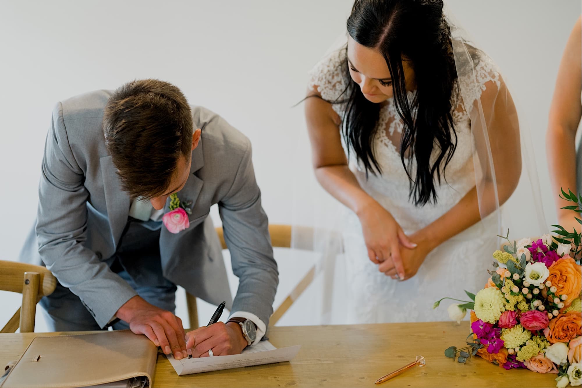 signing marriage license at carper winery wedding norwalk iowa