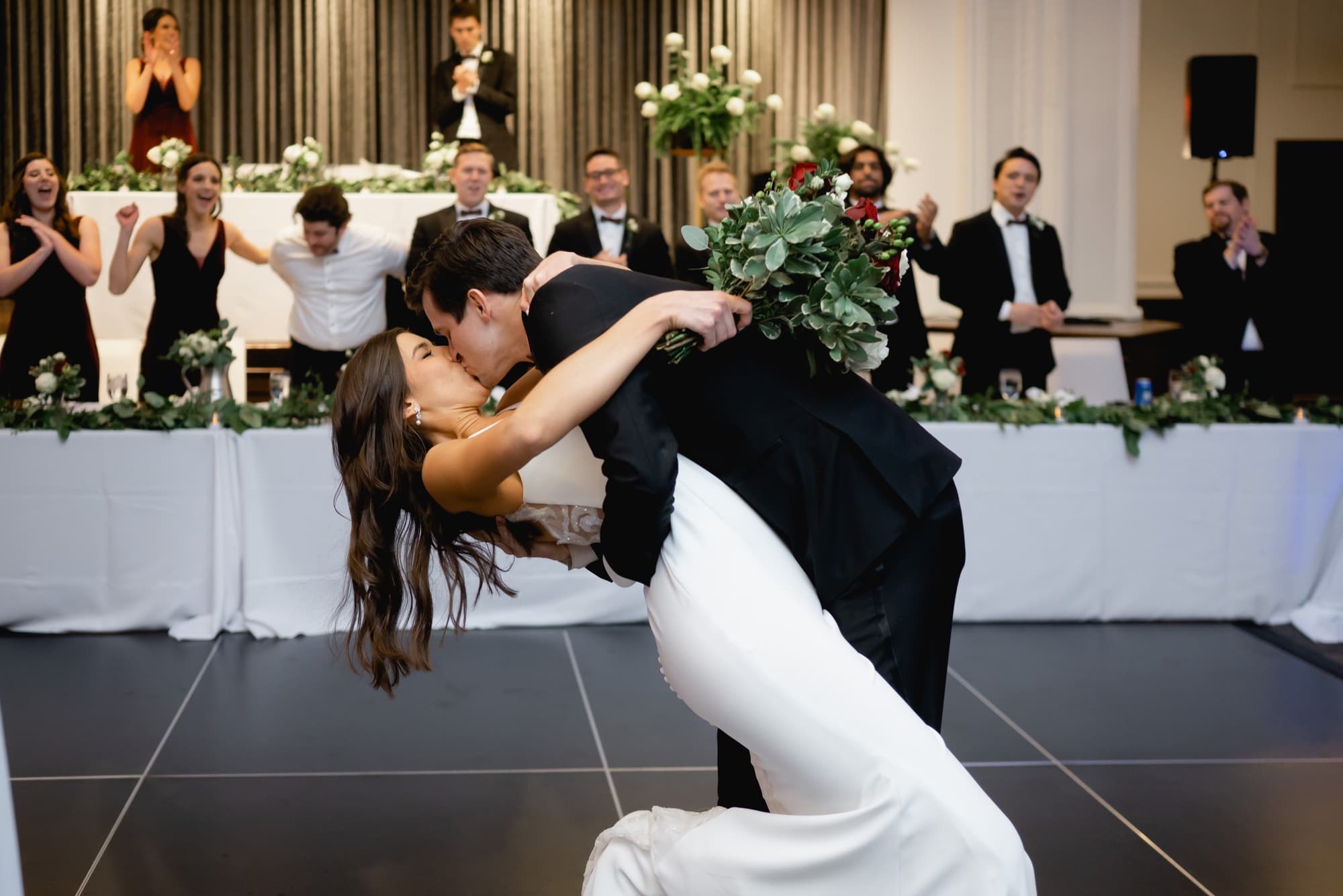 bride and groom kiss at the tea room wedding reception iowa