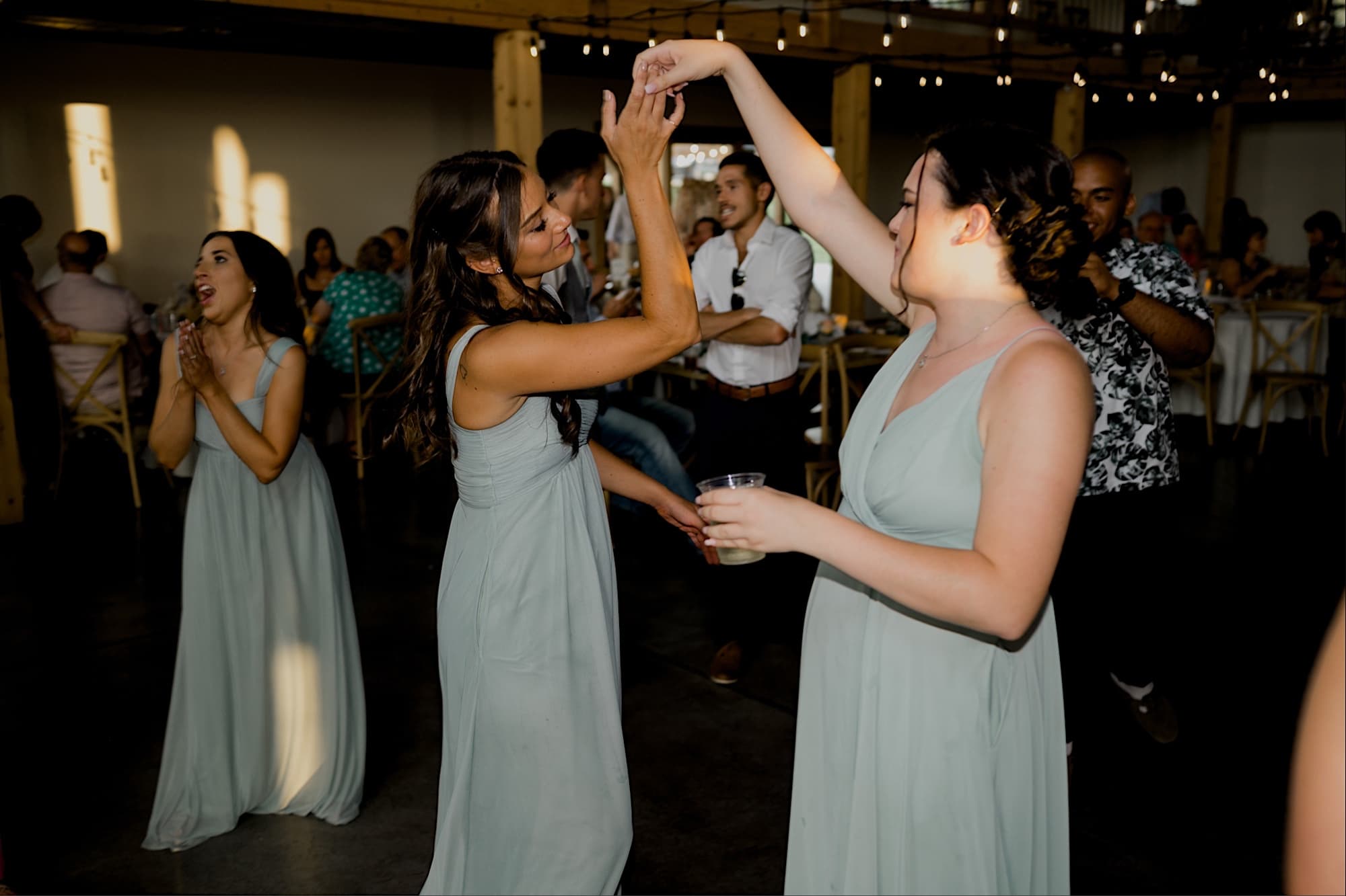 bridesmaids dancing at carper winery wedding norwalk iowa