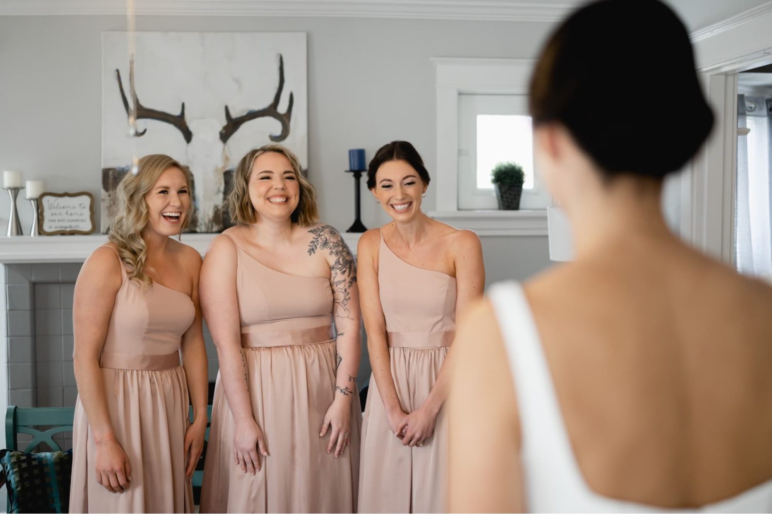 Bride first look with bridesmaids at Airbnb
