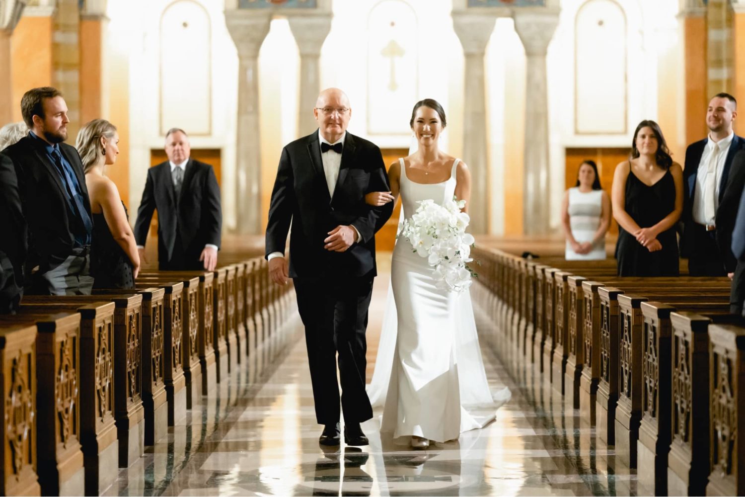 Father of the bride walking bride down the aisle at the Cathedral Basilica of St. Louis
