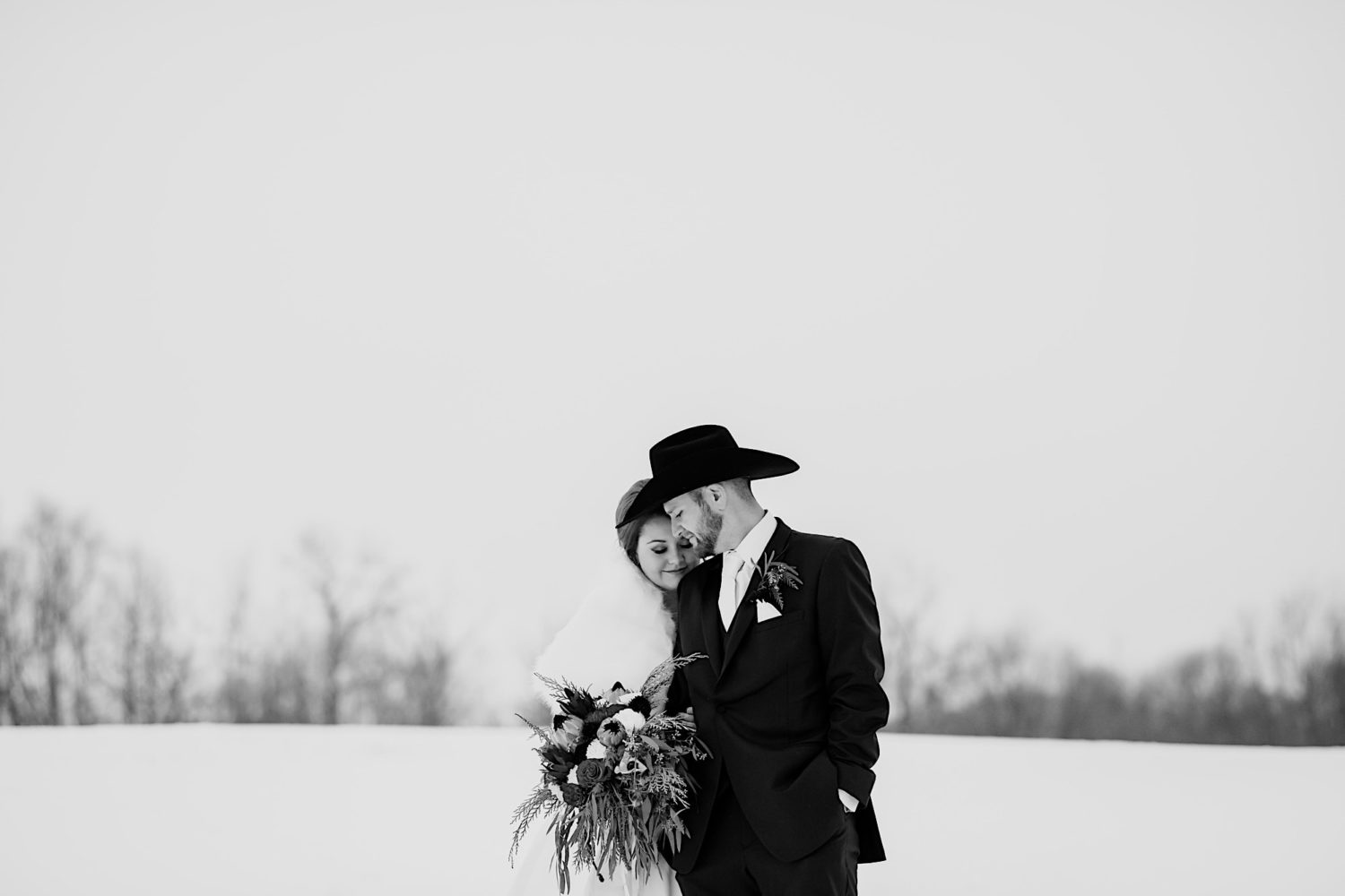 bride and groom snow portraits baraboo Wisconsin