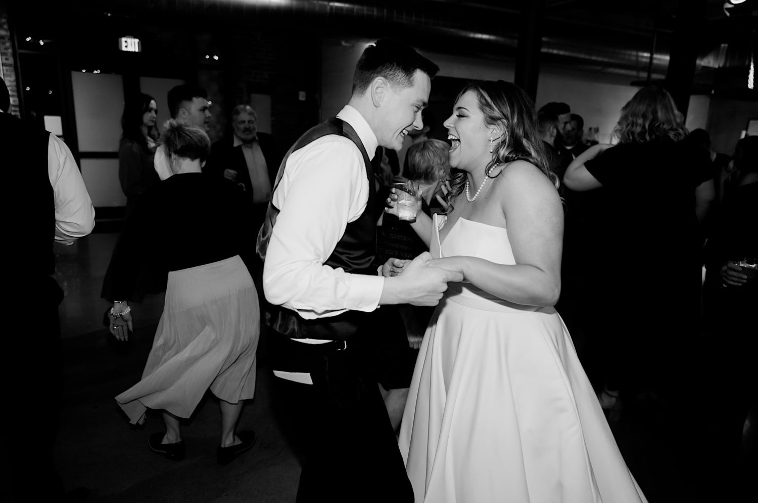 bride and groom candid dancing photos the river center des moines