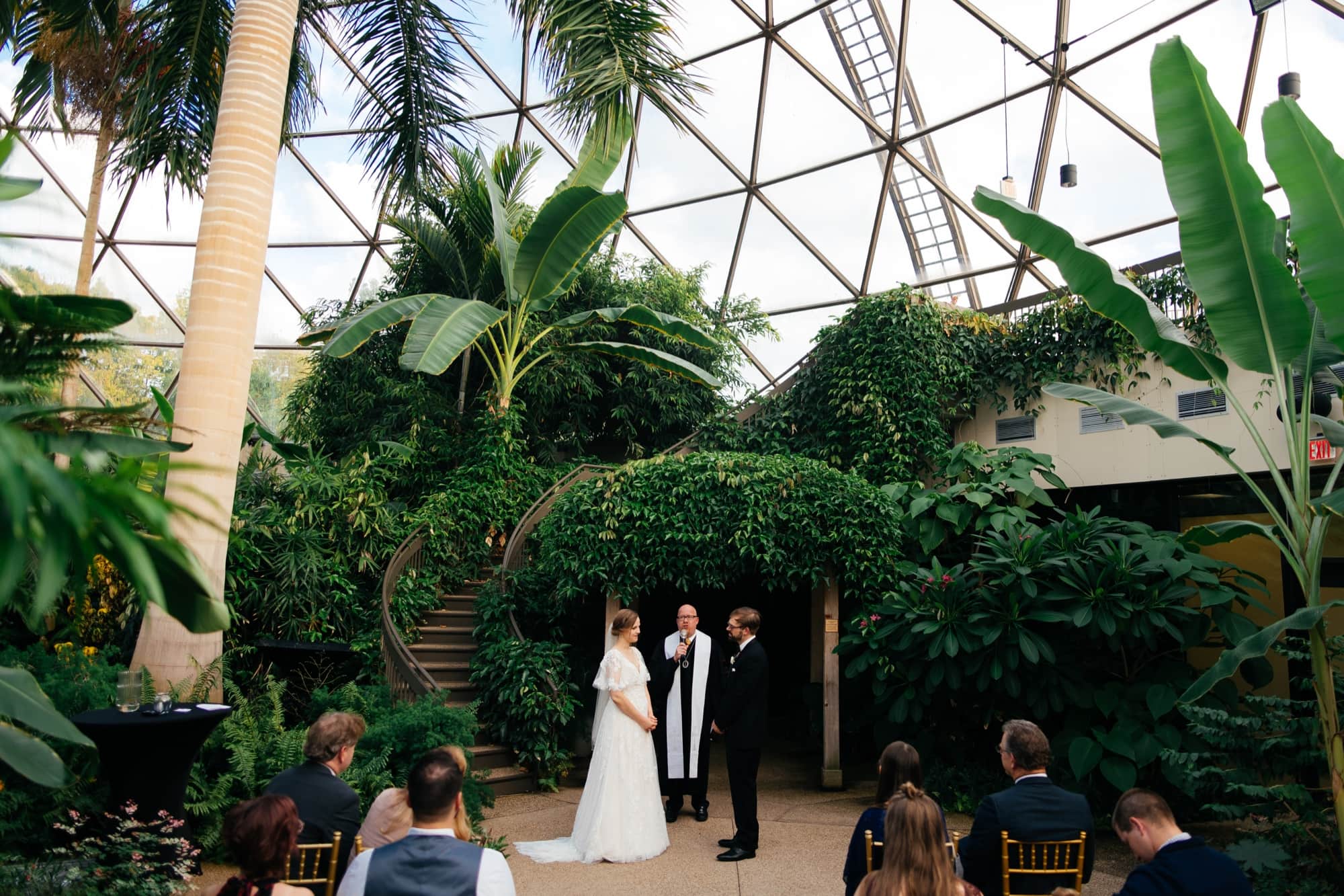 Wedding ceremony inside the Conservatory at the greater Des Moines botanical Garden