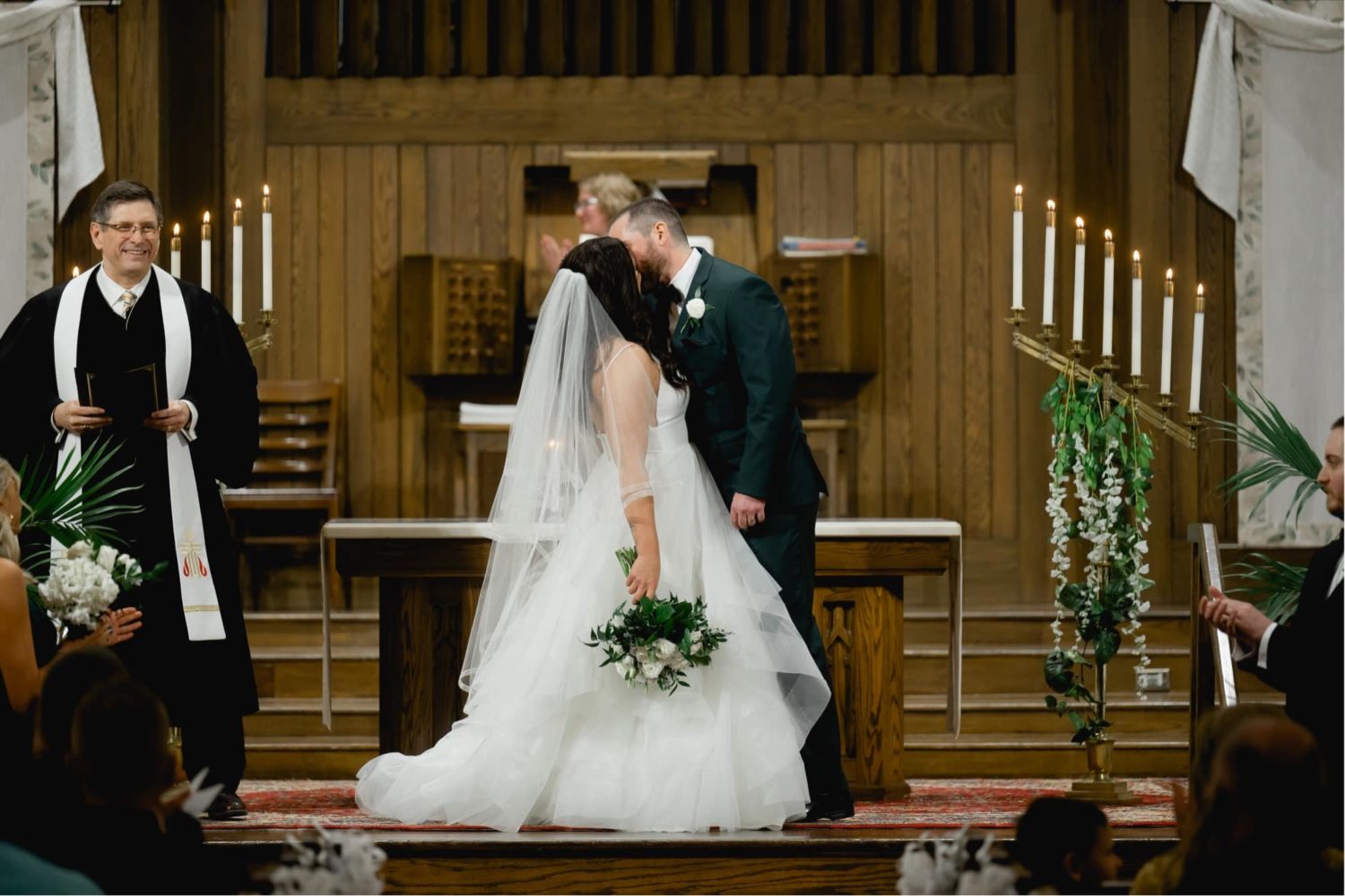 Bride and groom first kiss at Westminster Presbyterian Church