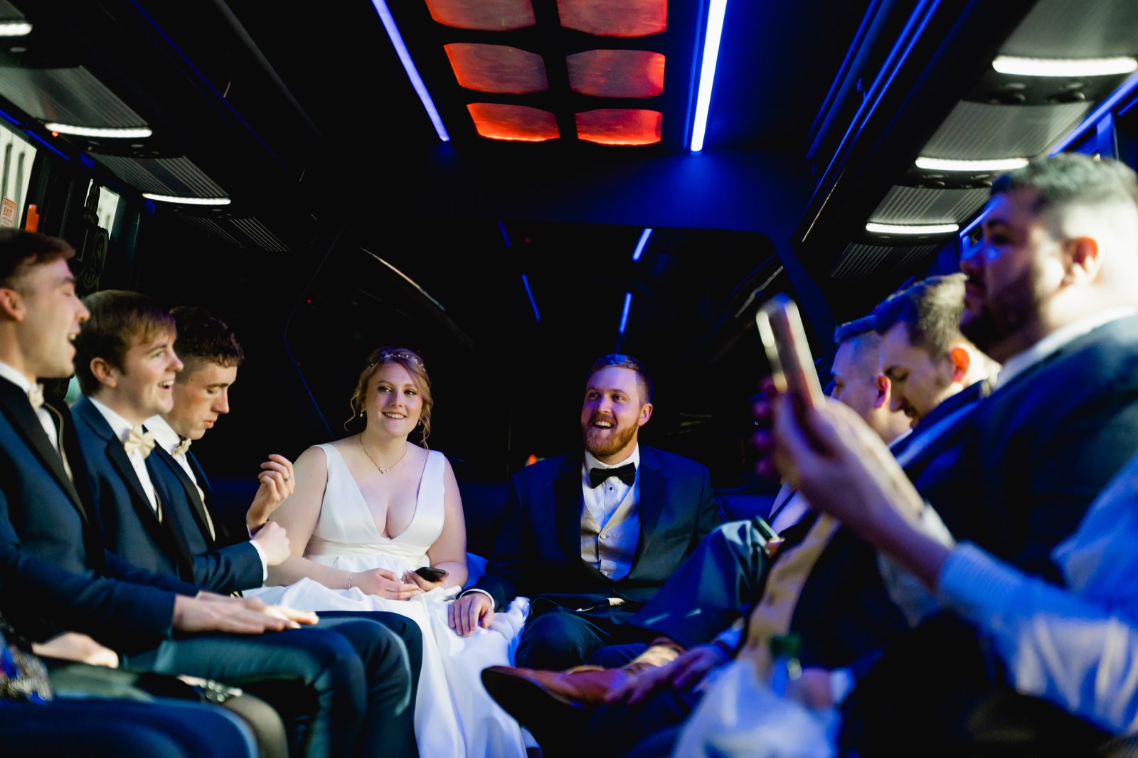 Bride and groom and limousine