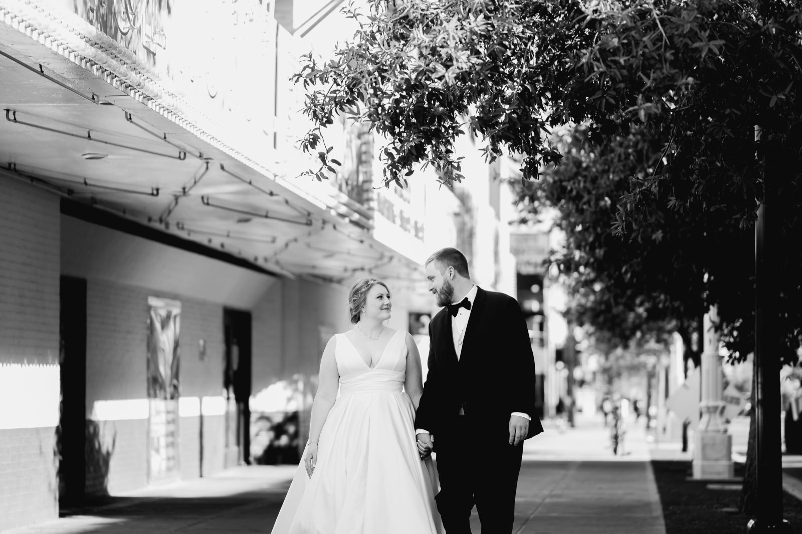Bride and groom walking down the Fremont Street