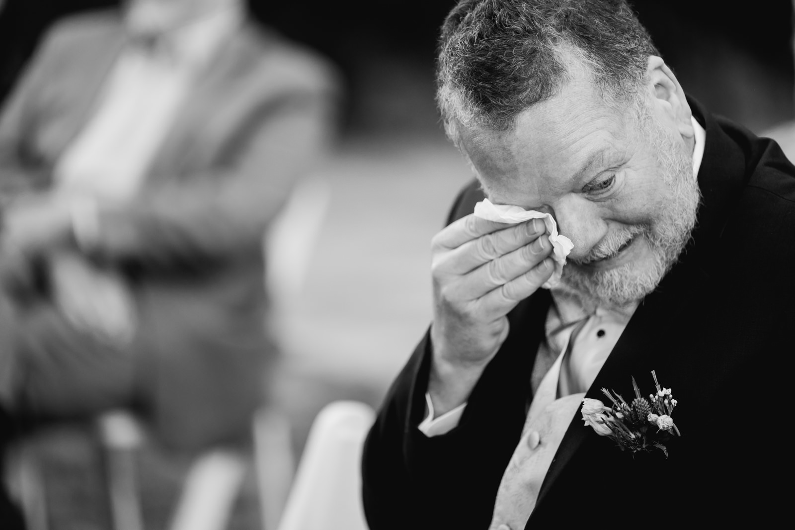 Father of the bride crying at the wedding ceremony