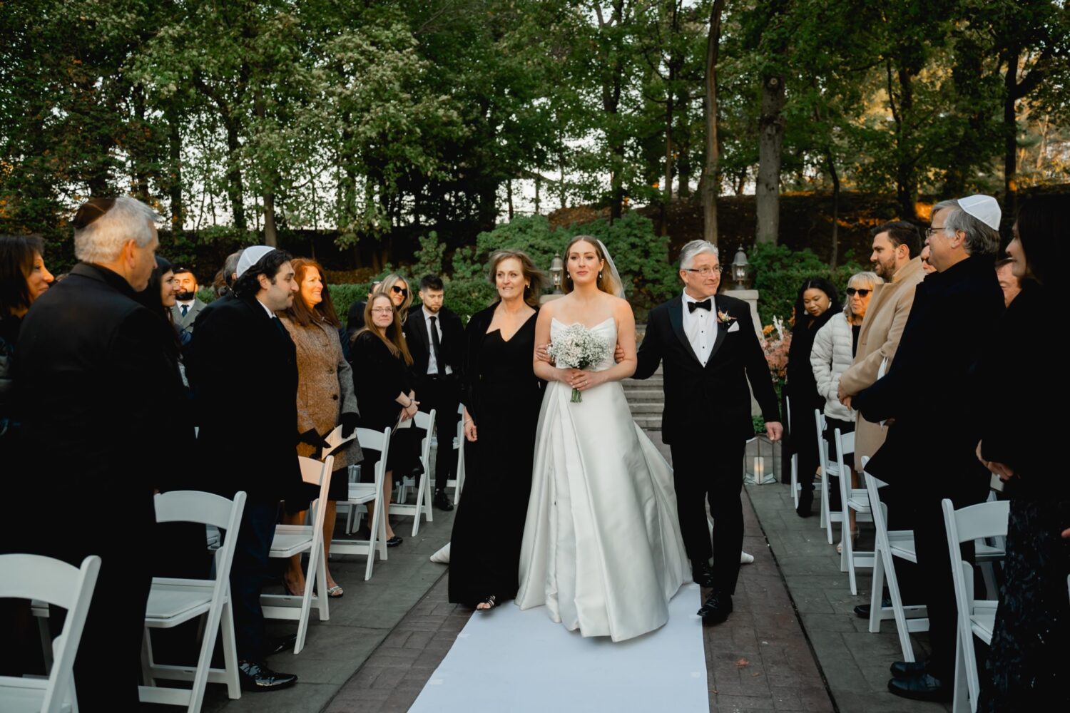 bride walking down aisle at Tappan Hill Mansion in the fall
