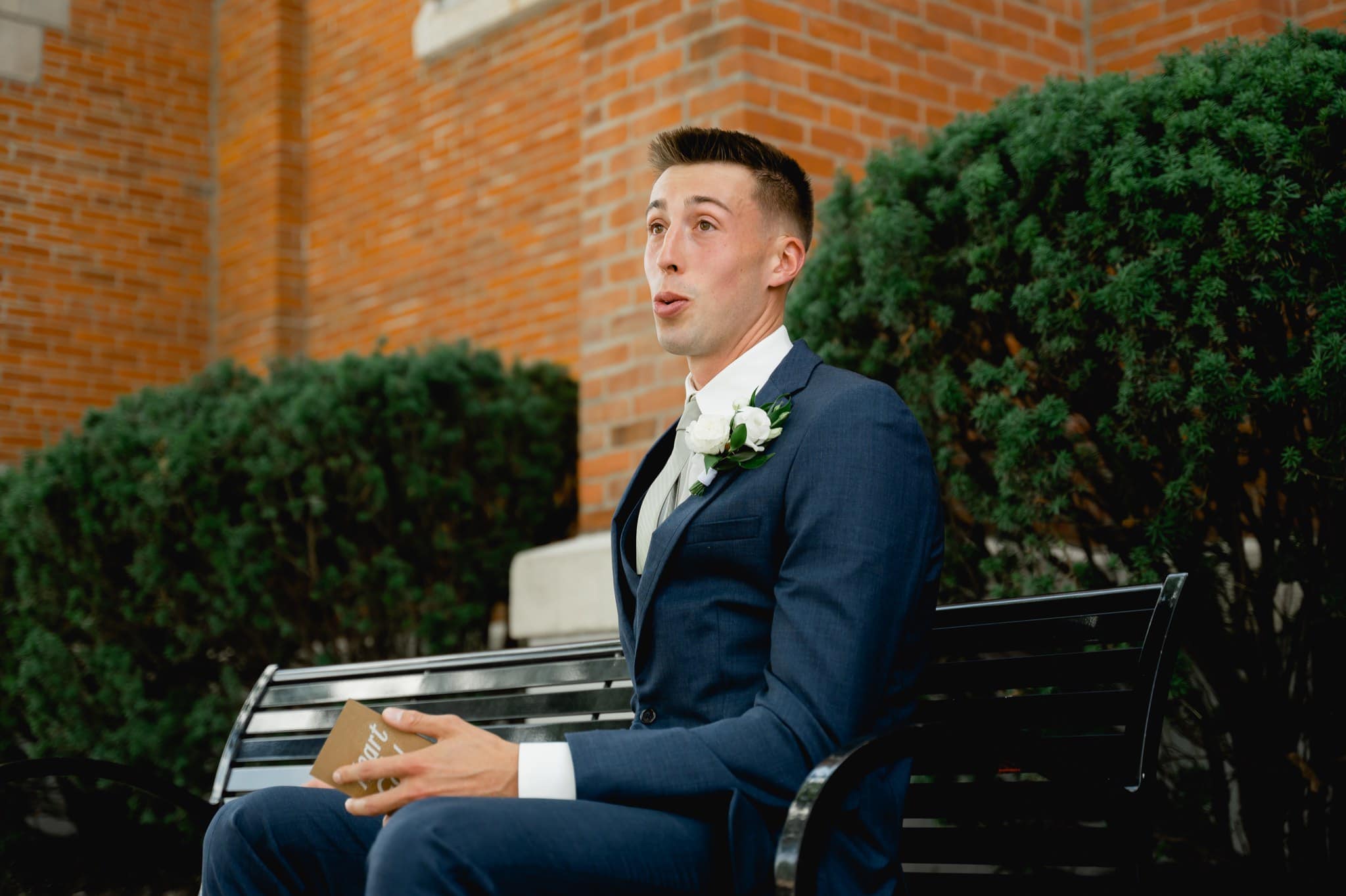 groom getting emotional reading letter from bride