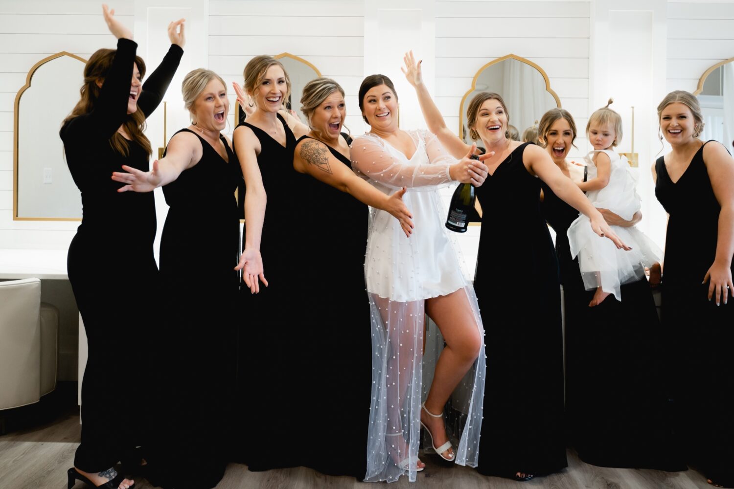bride with bridesmaids in Toast Ankeny bridal suite