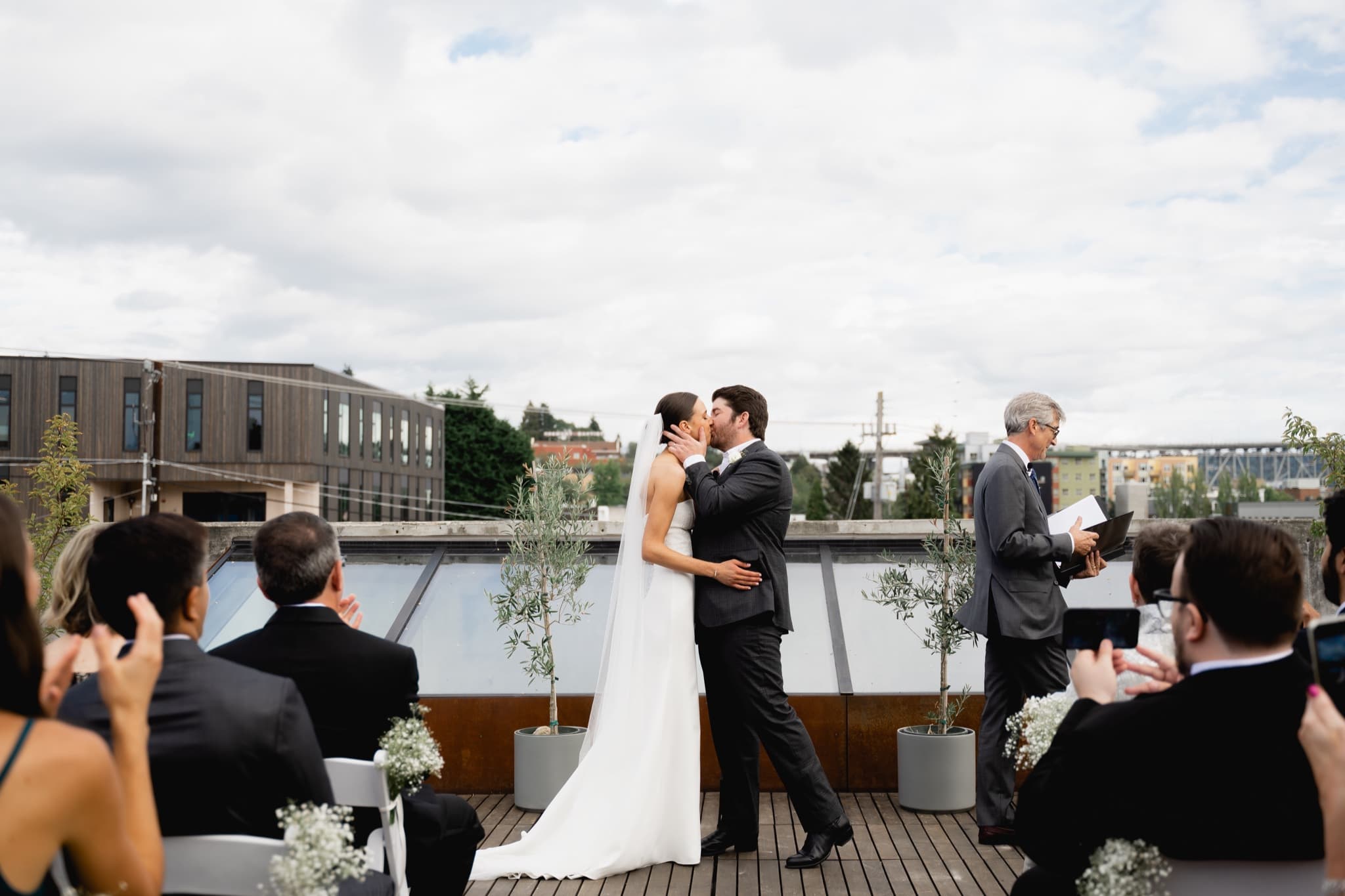 bride and groom kissing on the rooftop at Fremont Foundry