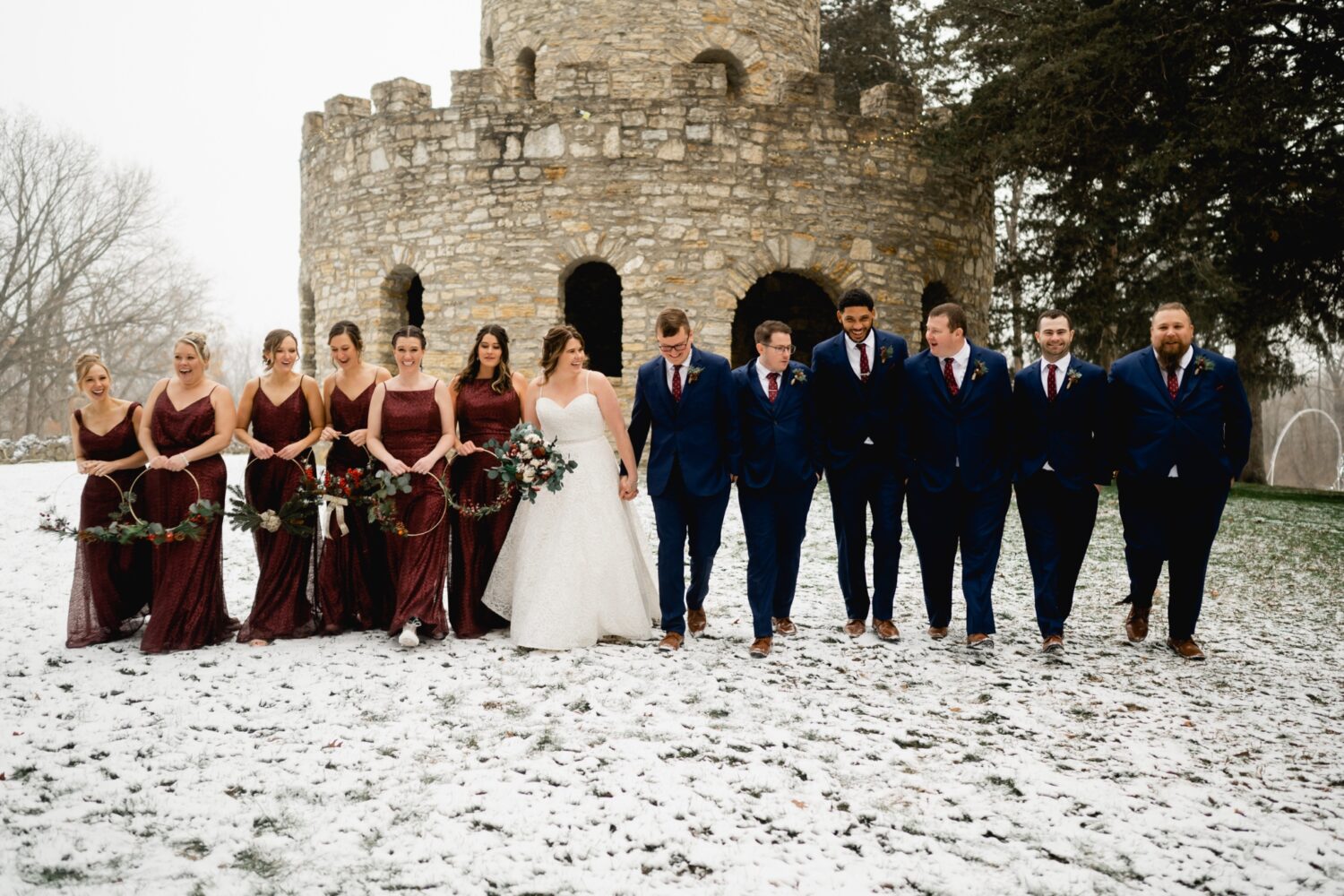 bridal party in front of castle at Eagle Point Lodge wedding