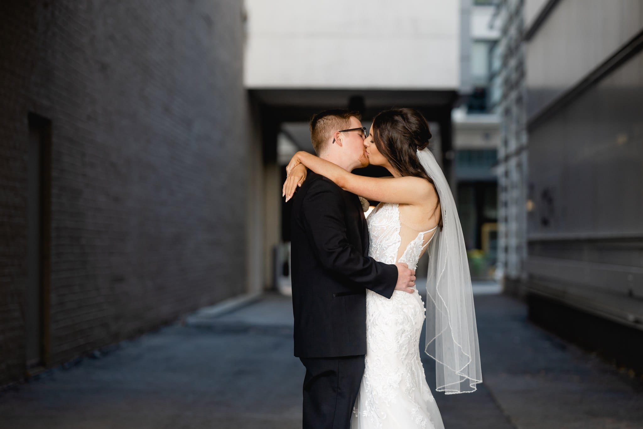 bride and groom kiss in des moines