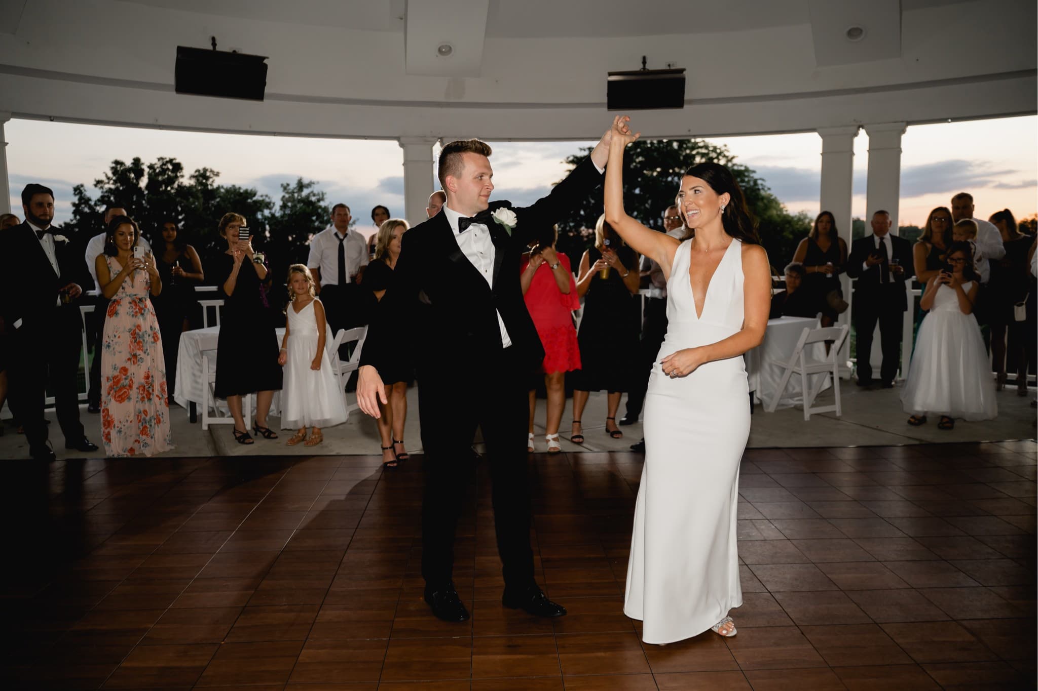 bride and groom first dance outside at glen oaks country club
