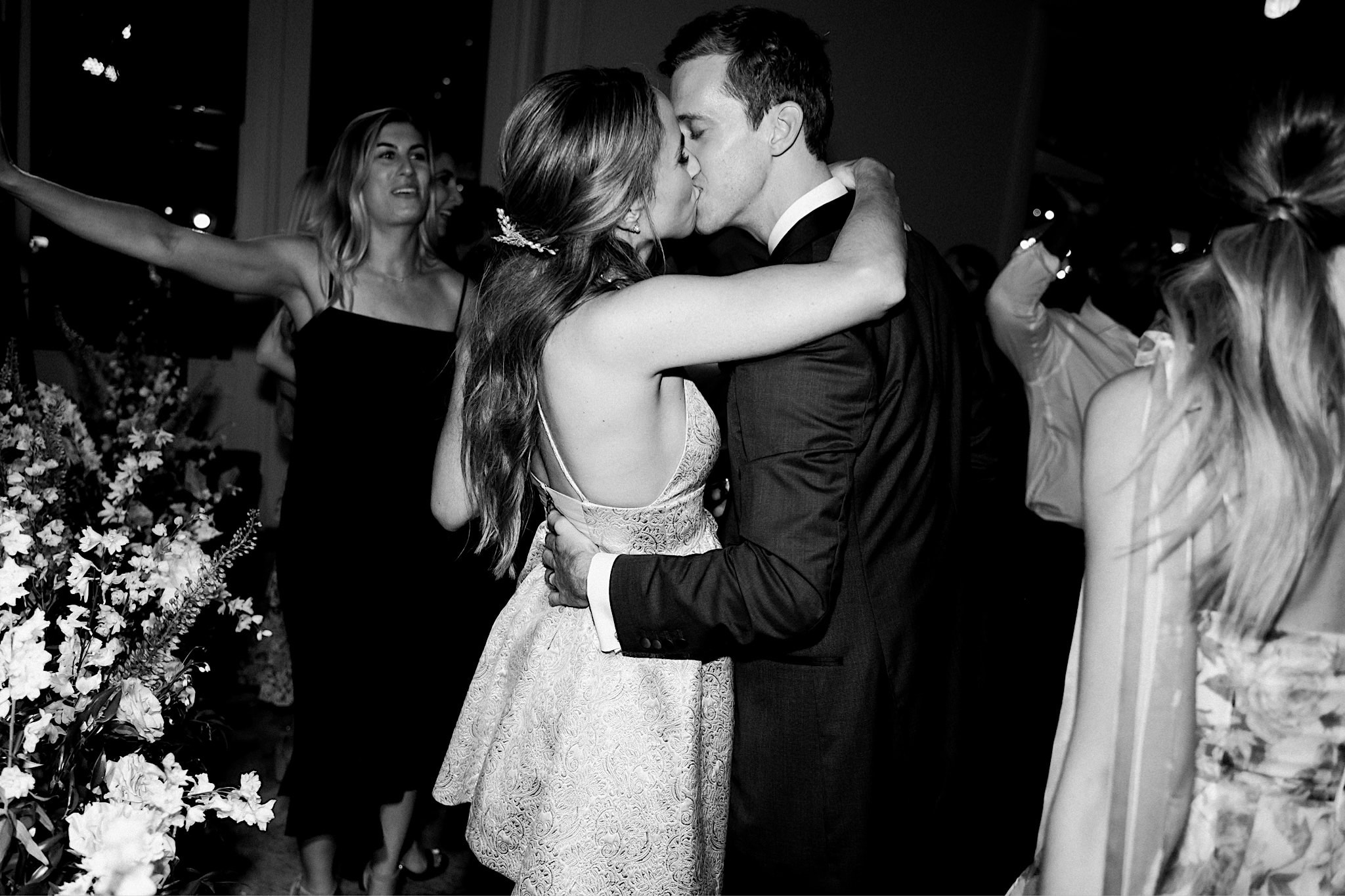 bride and groom kissing at the end of the night