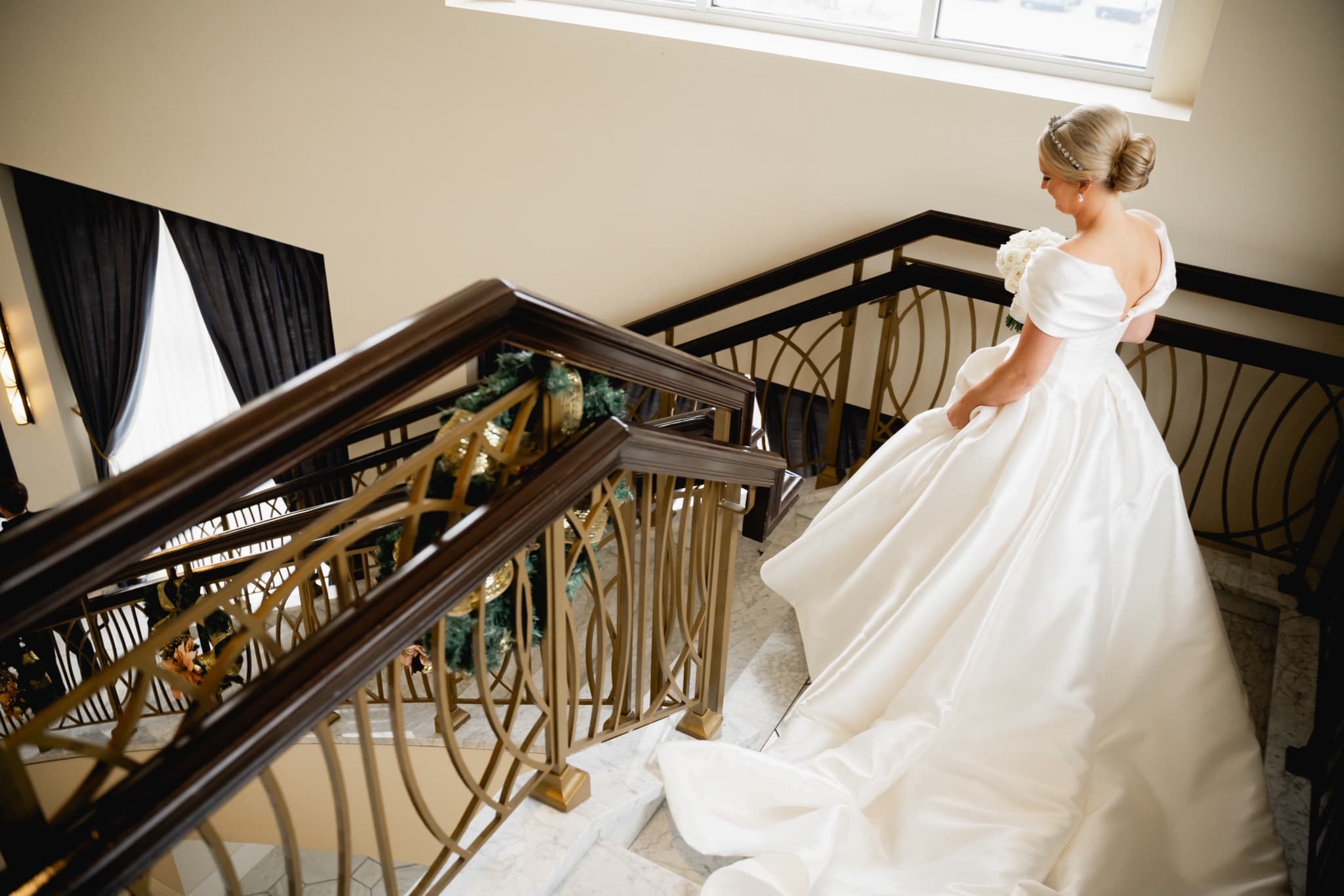 bride and groom first look on the stairs