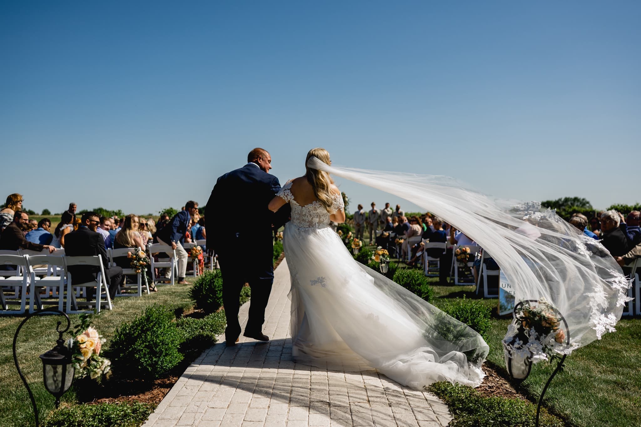 wind blowing the brides veil during ceremony