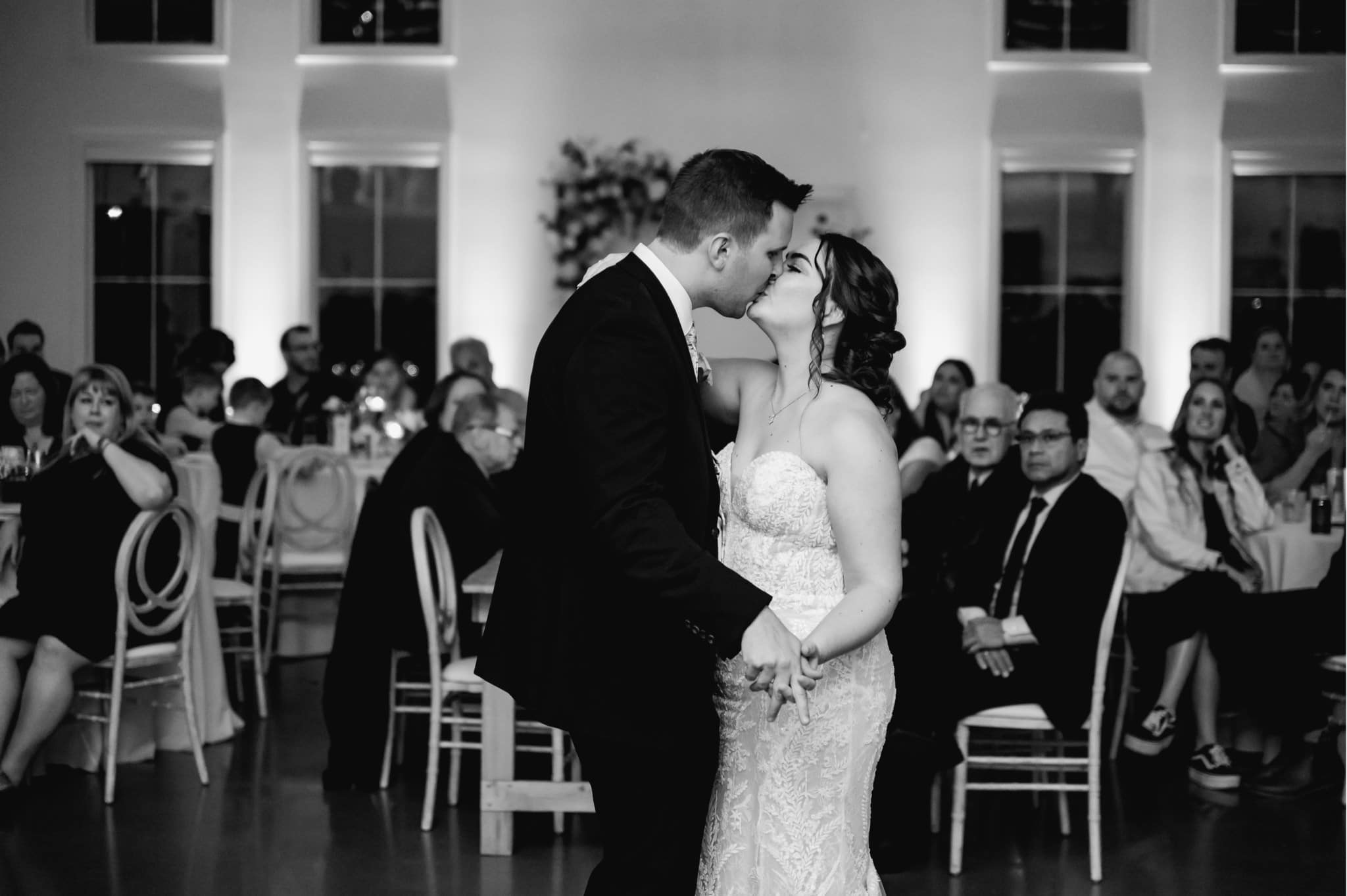 bride and groom kissing on the dance floors