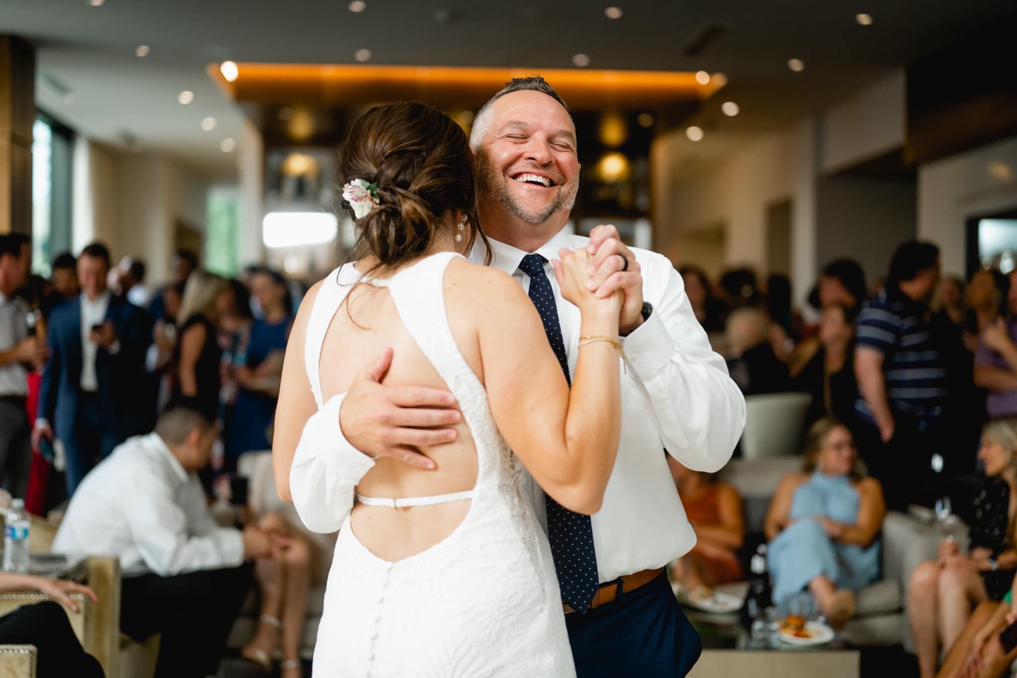 groom laughing during first dance