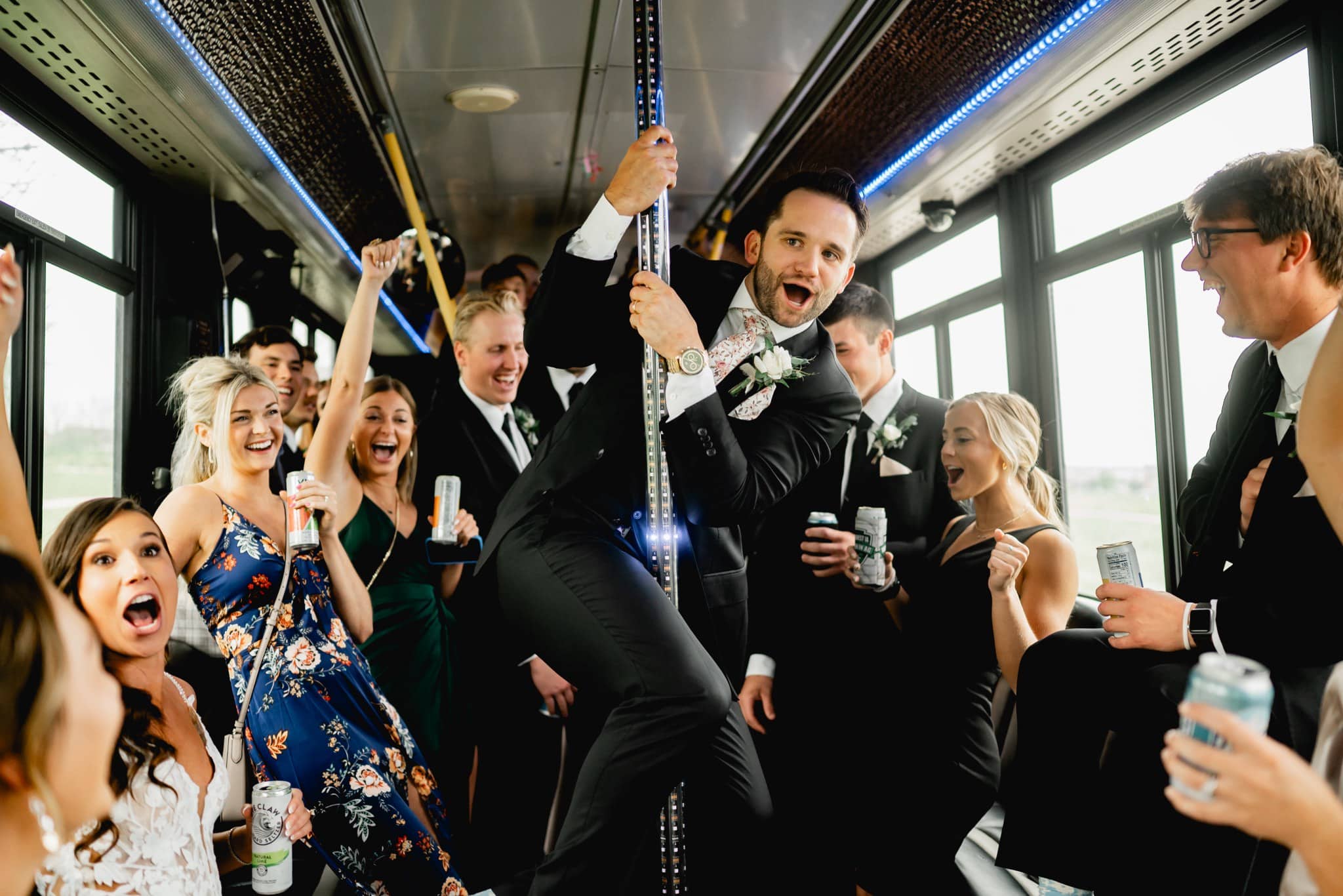 groom partying on the wedding bus