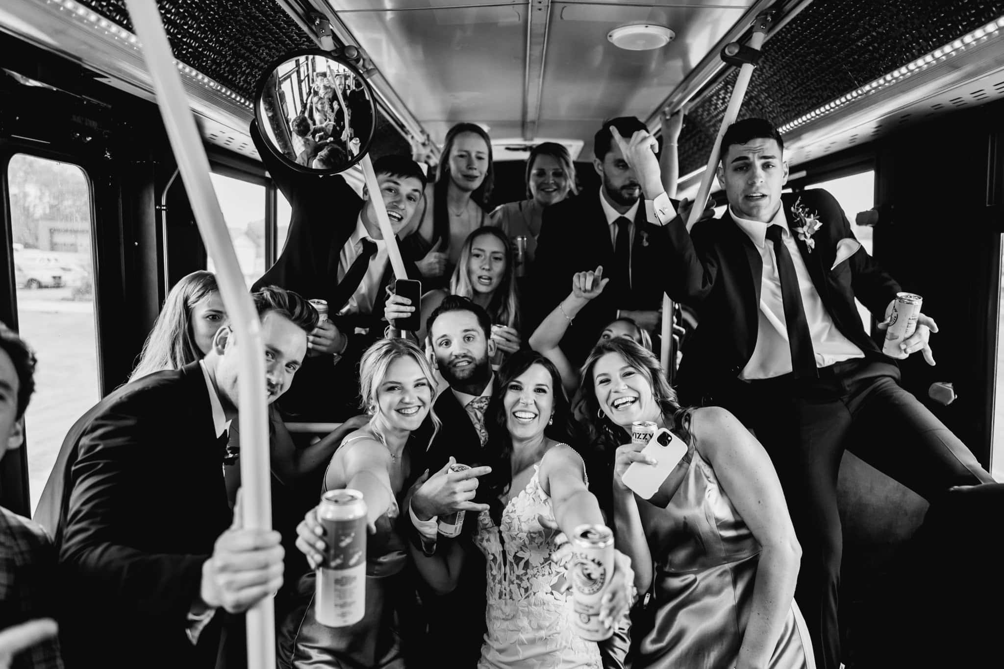 wedding party celebrating on party bus