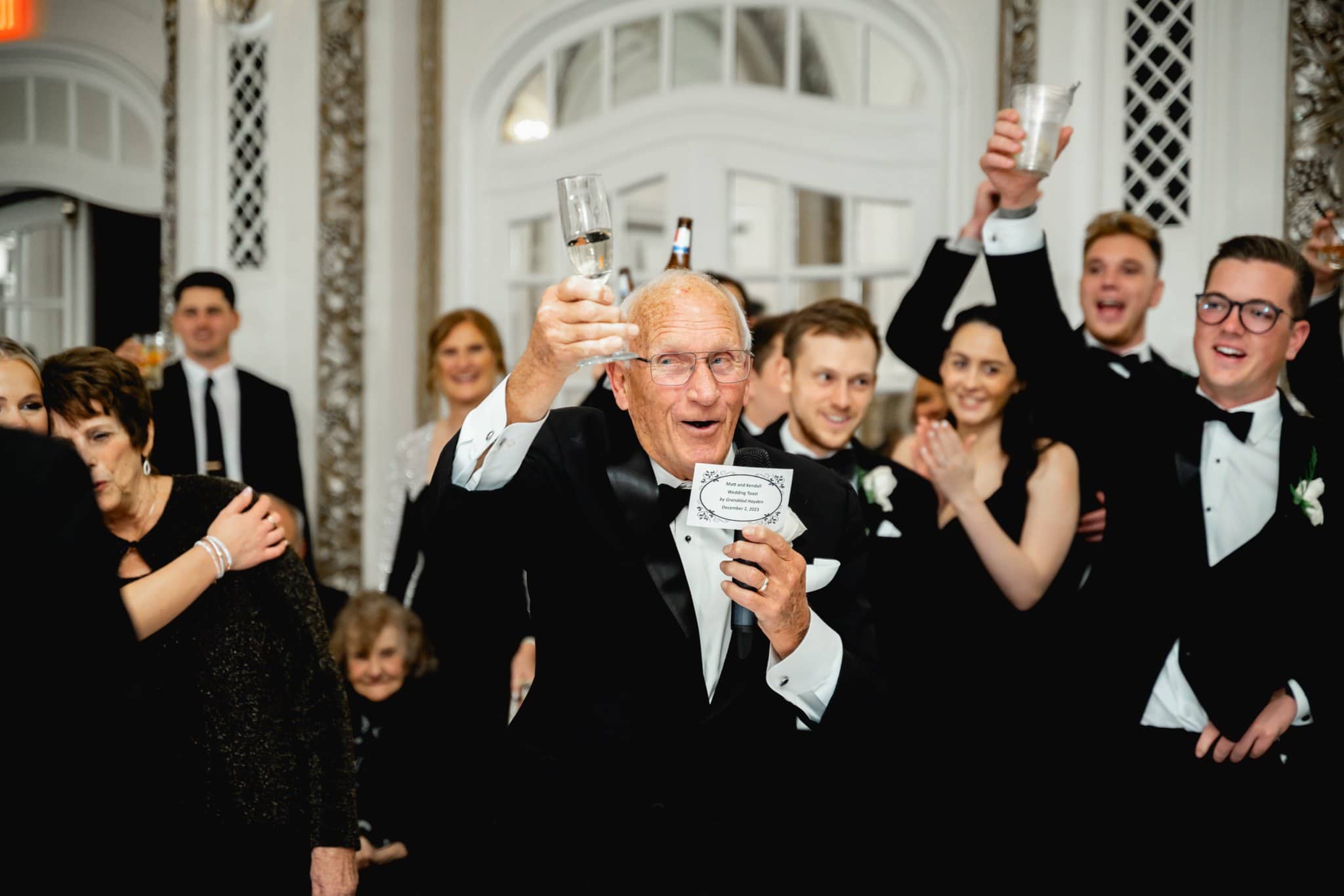 grandfather giving toast at wedding